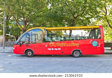 STAVANGER, NORWAY - AUGUST 16, 2014: World famous red city sightseeing bus waiting for tourists in the center of Stavanger, Norway