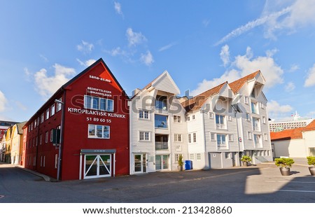 STAVANGER, NORWAY - AUGUST 16, 2014: Old houses (circa XIX c.) on Havneringen street (part of Blue Promenade) of historic center of Stavanger, Norway. Buildings are former wharf warehouses