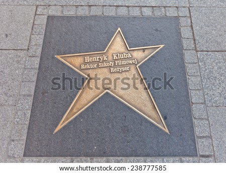 LODZ, POLAND - OCTOBER 19, 2014: Brass star for Henryk Kluba on Walk of Fame on central Piotrkowska Street in Lodz, Poland. Henryk Kluba (1931-2005) was a Polish actor and film director