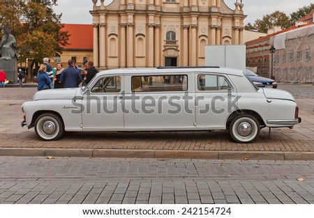 WARSAW, POLAND - OCTOBER 18, 2014: Wedding limousine retro car in front of Visitationist Church in Warsaw, Poland. Modified Polish automobile Warszawa model 223 (circa 1960s)