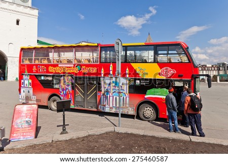 KAZAN, RUSSIA - APRIL 19, 2015: Famous red double-decker city sightseeing bus near the Kremlin in Kazan city, Republic of Tatarstan, Russia