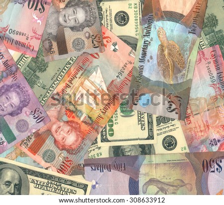 GEORGE TOWN, CAYMAN ISLANDS - AUGUST 22, 2015: Cayman Islands (British Overseas Territory) currency (Cayman dollars) and USA dollars background