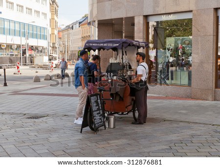 BRATISLAVA, SLOVAKIA - AUGUST 24, 2015: Coffee Brothers retro style mobile bicycle coffee cart in Bratislava, Slovakia