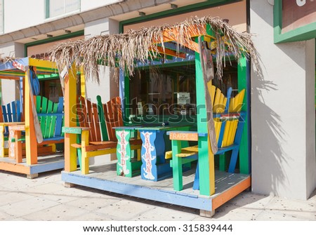 GEORGE TOWN, CAYMAN ISLANDS - SEPTEMBER 12, 2015: Colorful cabin of street cafe in George Town of Grand Cayman, Cayman Islands (British Overseas Territory)
