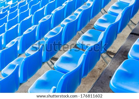 Photo of Empty dark blue chairs at the football Stadium