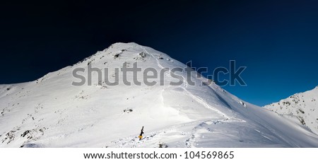 Mountains winter panorama in white and blue  in white and blue