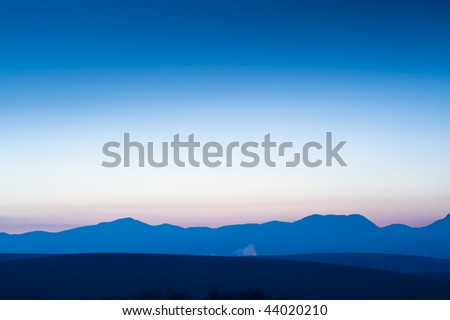Mountain horizon in sunrise, simple blue pink