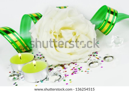 white rose and green burning candles