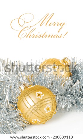 Greeting card with space for text with a pair of golden christmas balls on silver tinsel