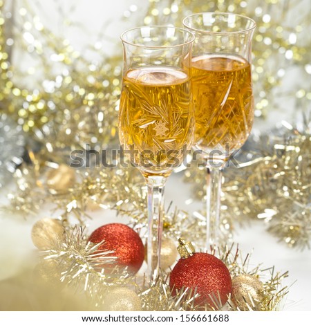 Wine in a glasses with christmas new year decorations and front bokeh