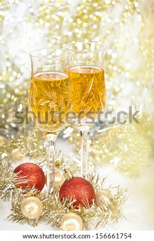 Wine in a glasses with christmas new year decorations and front bokeh