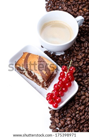 A cup of coffee with marble cake and red currant on a coffee background with copyspace