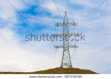 metal electricity pylon  transmit  electricity  on the sky background city