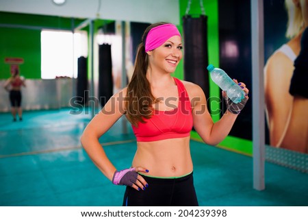 beautiful sport  woman drink water bottle