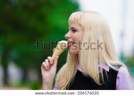 portrait  beautiful blonde woman eating ice cream