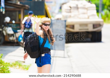 beautiful  tourist  woman with backpack city background