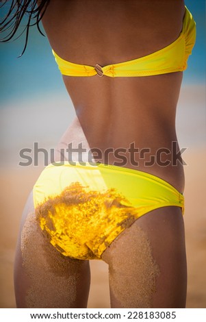 beautiful  back and ass woman in yellow bikini posing  tropical  blue sea water has sports and tan body