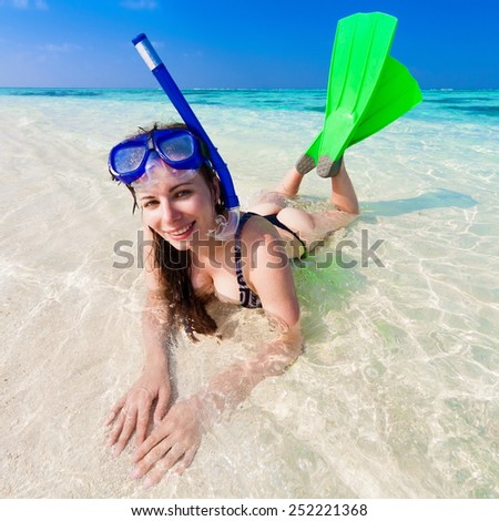 beautiful fun smiling sexy young women  with flippers, mask and tube snorkeling in Maldives  romantic  atoll island paradise luxury  resort about coral reef