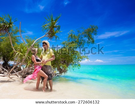 beautiful sexy woman and man with sunglasses in beach, bikini, hat, blue sun sea tropical nature background luxury  resort island palm about coral reef, tan sport athletic body, people holiday