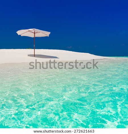 beautiful parasol and sunbed blue sun sea tropical nature background holiday luxury  resort island atoll about coral reef