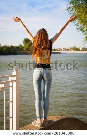 beautiful sensuality elegance lady haired woman happy fun back black t-shirt jeans urban city portrait nature slim sport body river blue sky river water ass