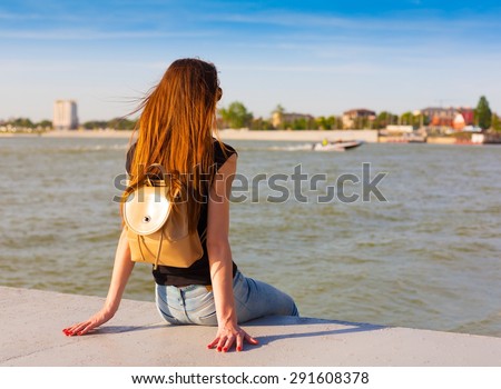 beautiful sensuality elegance lady red haired hair woman happy fun back black t-shirt jeans urban city portrait nature slim sport body river blue sky river water