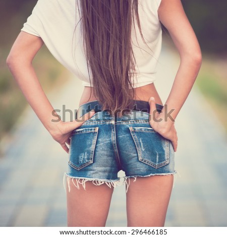 beautiful sensuality elegance haired long hair woman happy fun urban city portrait back ass tourist jeans shorts nature slim sport tan body space impressions travel white t-shirt instagram filter
