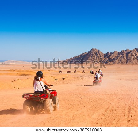 Motorcycle safari in the land Egypt. People travel. Beautiful  holiday background. Extreme hobby games.  Speed achievement tracking. Amazing desert Sharm.