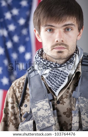 Portrait of tired soldier over american flag