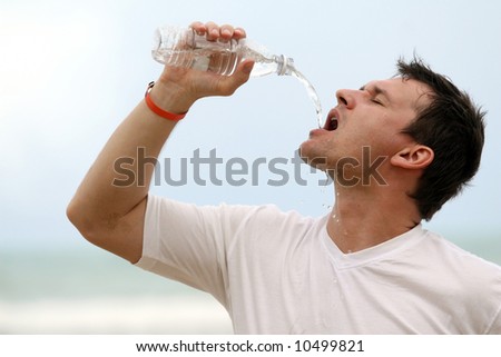 man drinking water after sport training