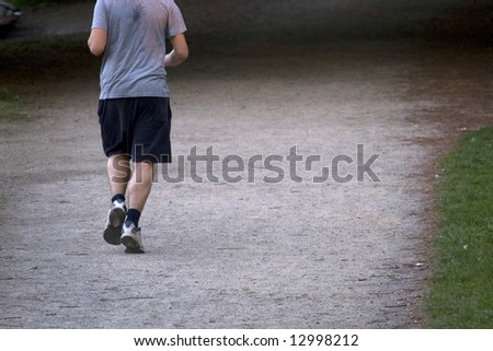 man running in park in the evening