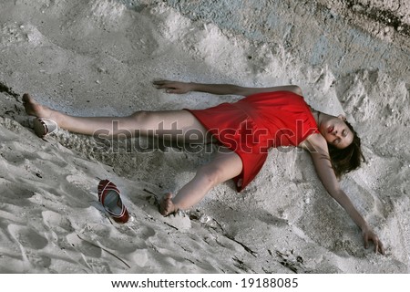 beautiful dead woman in the sand