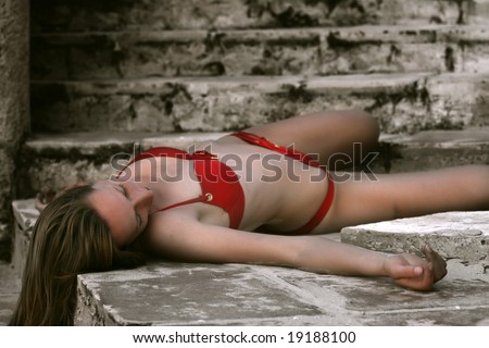 woman in red bikini dead on the stairs