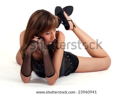 woman in patent leather lying on the white ground
