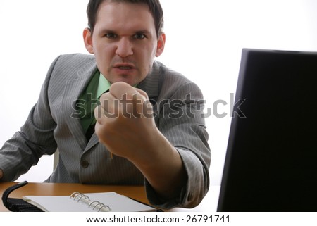 angry businessman showing his fist
