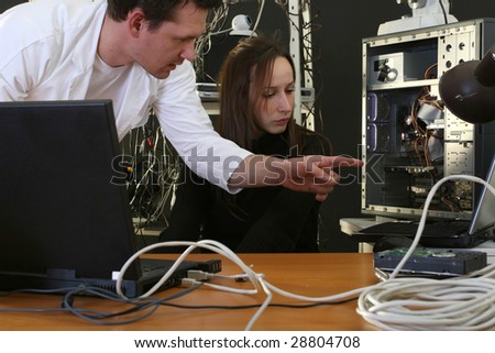 engineer stating the woman work on computer in the repair plant