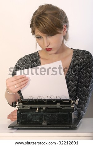 retro business woman reading letter on vintage typewriter