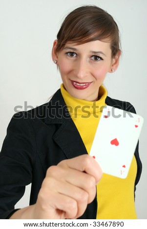 woman holding a playing card in the hand
