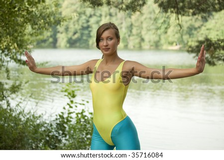 fitness woman doing fitness exercises in a natural setting