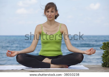 relaxing yoga and breathing exercises at the beach