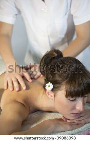 woman relaxing in spa and gets relaxing massage