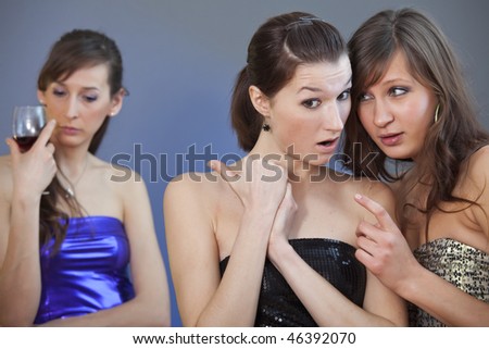 two girls gossip about other one on the party