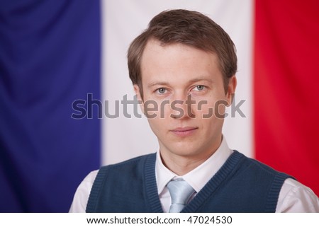 politician man posing - france flag in a background