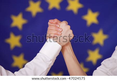european power - male and female hand in arm wrestling hold