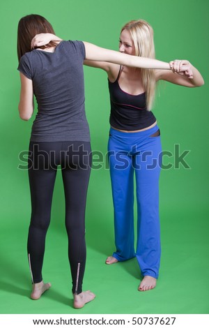 women self defense classes - exercises on green background