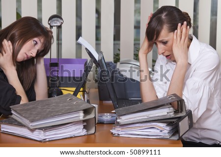 two businesswomen have stress by the work in office