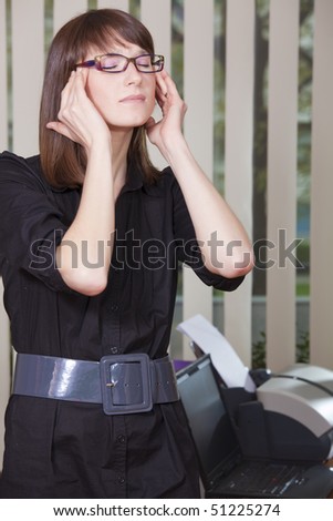 headache by work - businesswoman holding her head with both hands
