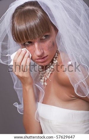 portrait of crying bride with a handkerchief