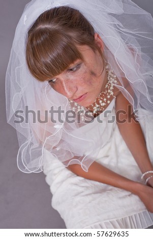 sad bride on the ground - studio shot