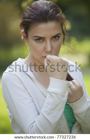 young fitness woman in fighting stance